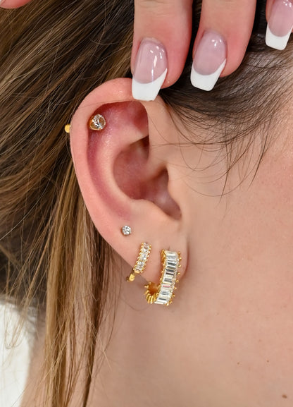 gold earrings on models ear