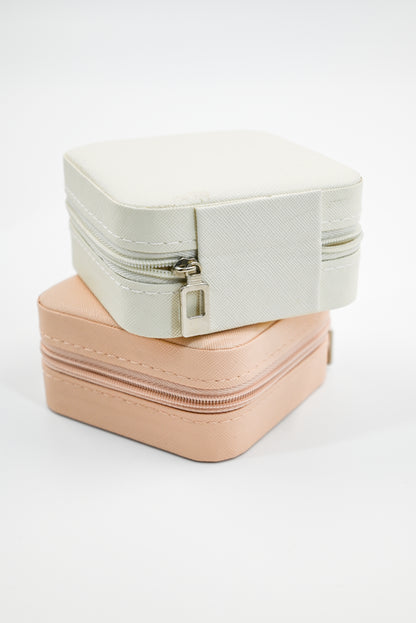 2 travel jewelry boxes on top of one and other showcasing the outside zipper