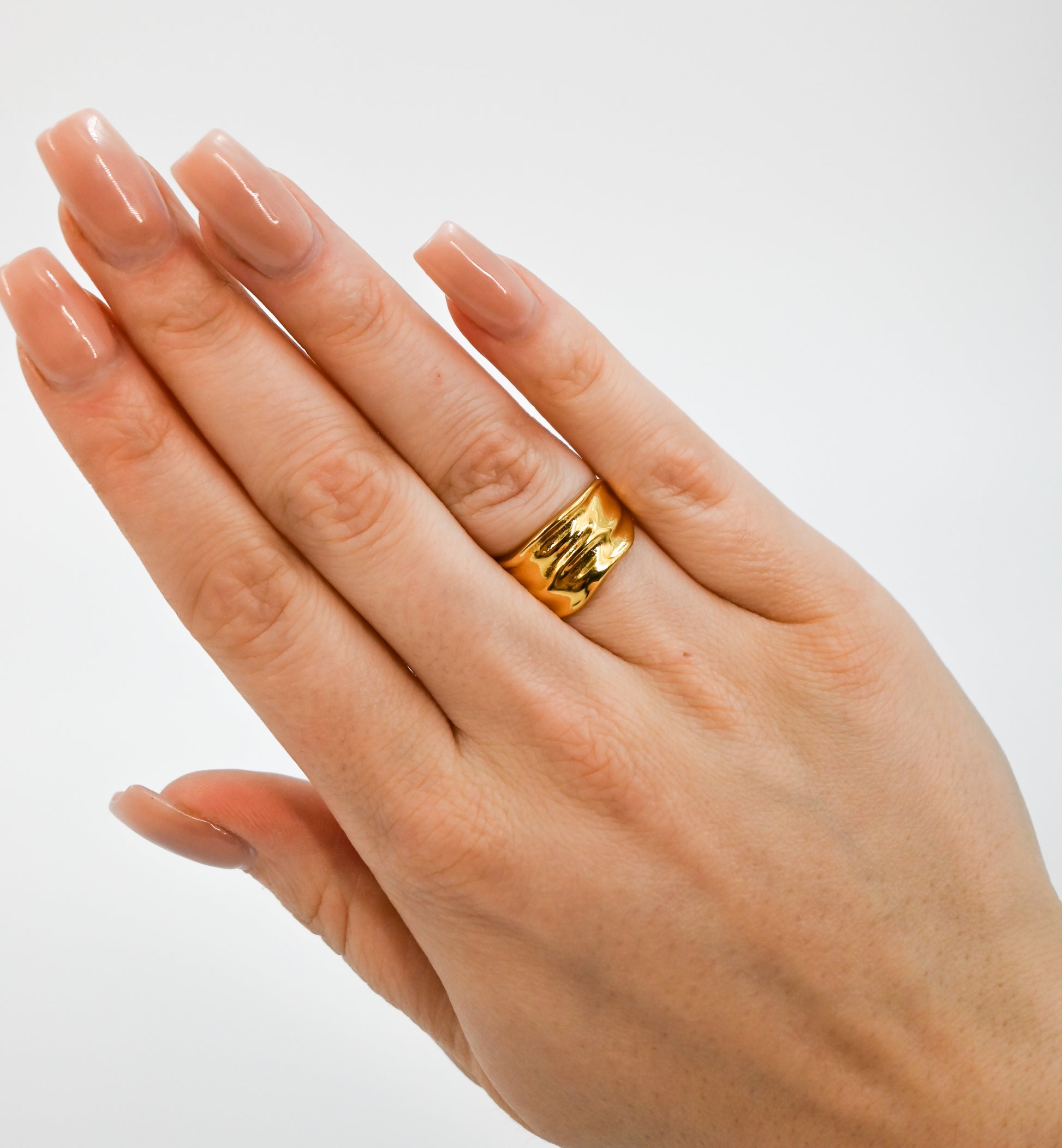 chunky gold ring on hand