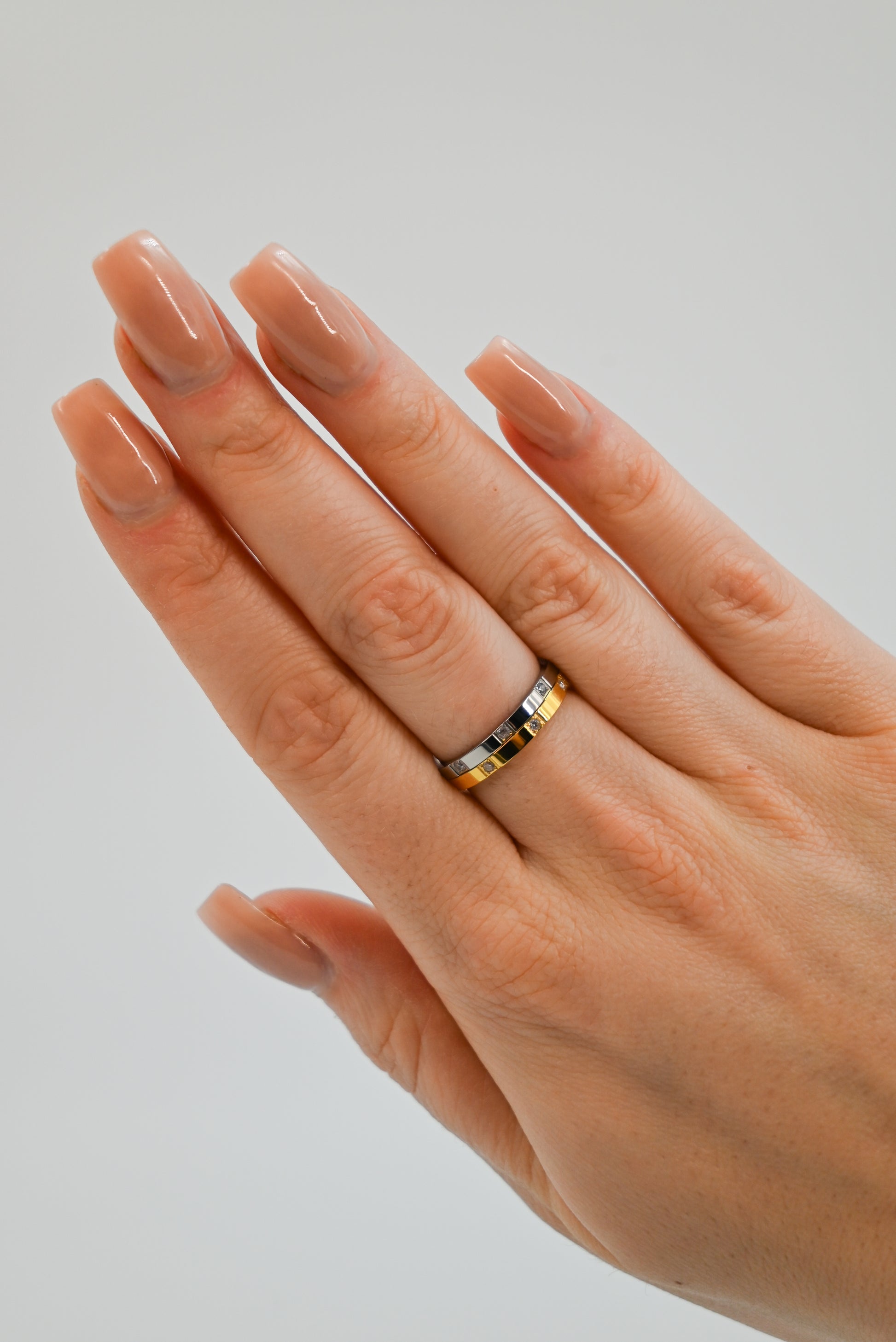 Cartier style ring in gold and silver on hand