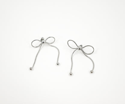 bow style earrings in silver