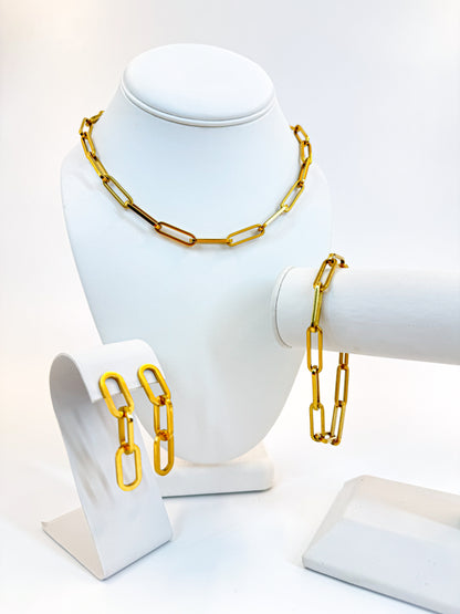 Large paperclip link bracelet, earrings, and necklace in gold