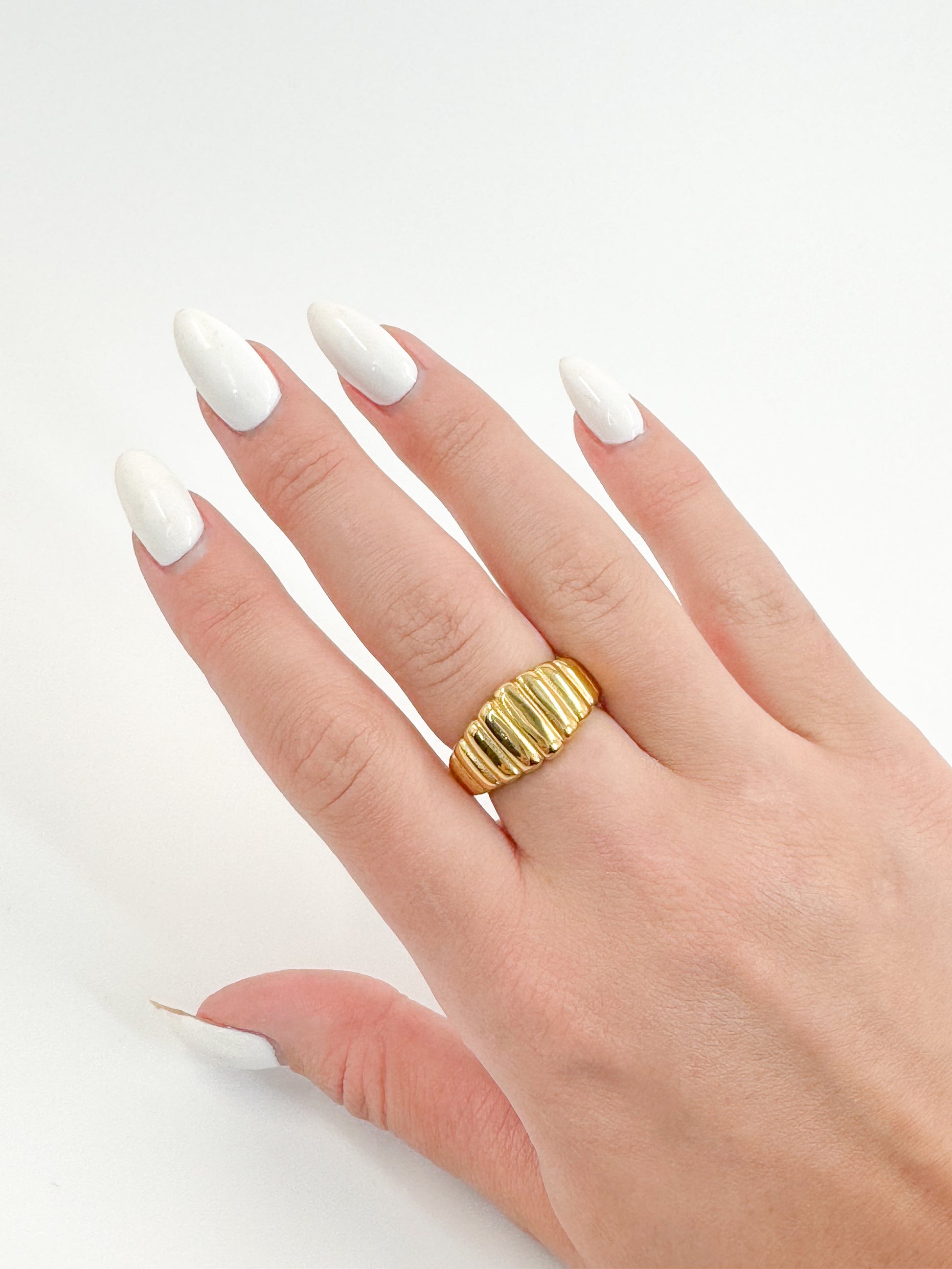 Model wearing croissant style gold ring 